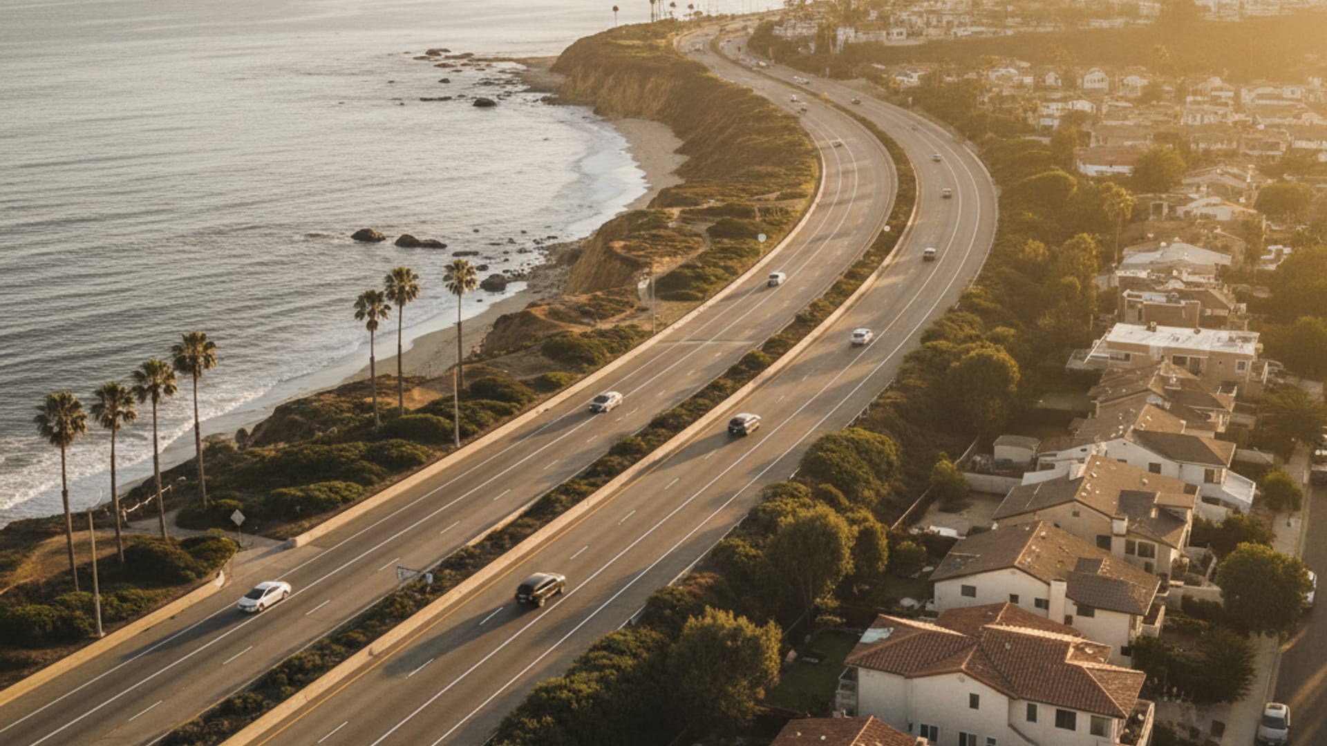 Aerial view of the Bay Area freeway network at golden hour showing the Peninsula, the bay, and inland hills
